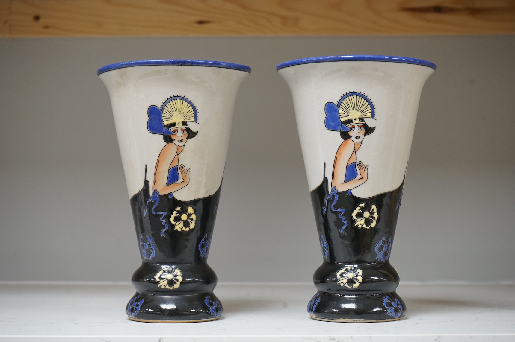 A pair of Longwy style 'flapper lady' pottery vases